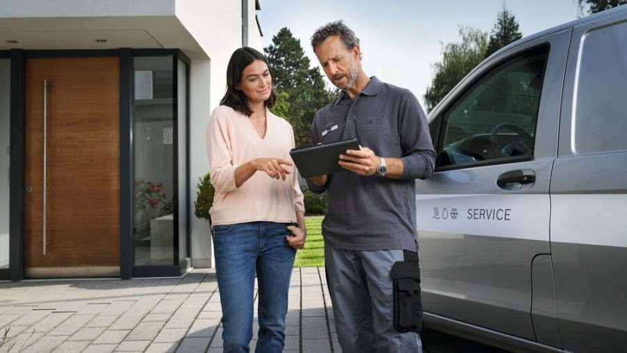 bosch installer with customer in front of car bosch installer with customer in front of car