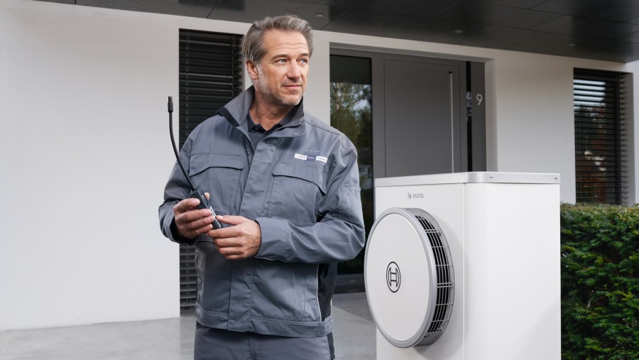 bosch installer with customer in front of car bosch installer with customer in front of car