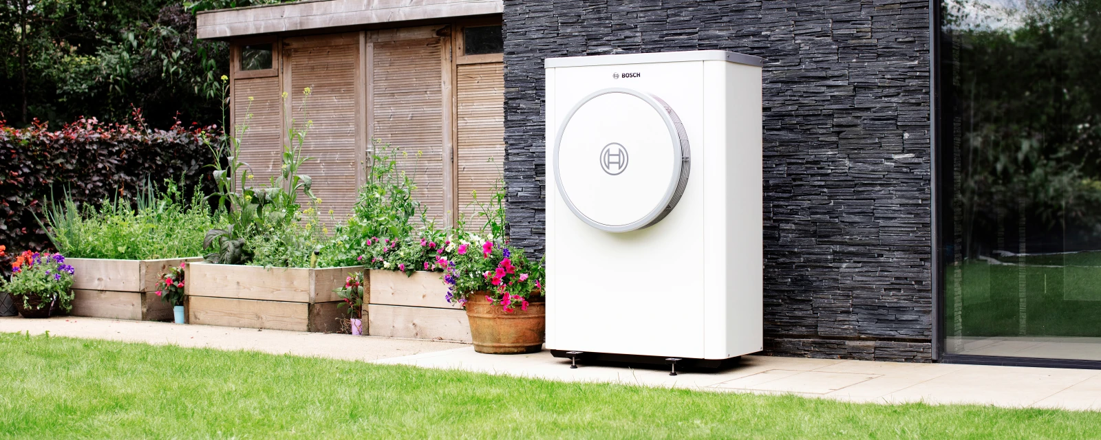 Bosch Compress 7400i AW heat pump standing on wall