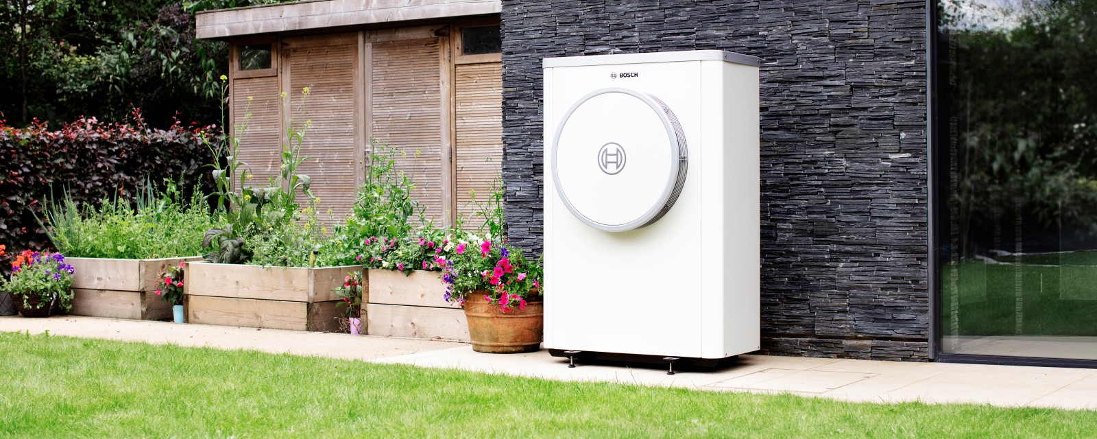 Bosch Compress 7400i AW heat pump standing on wall Bosch Compress 7400i AW heat pump standing on wall