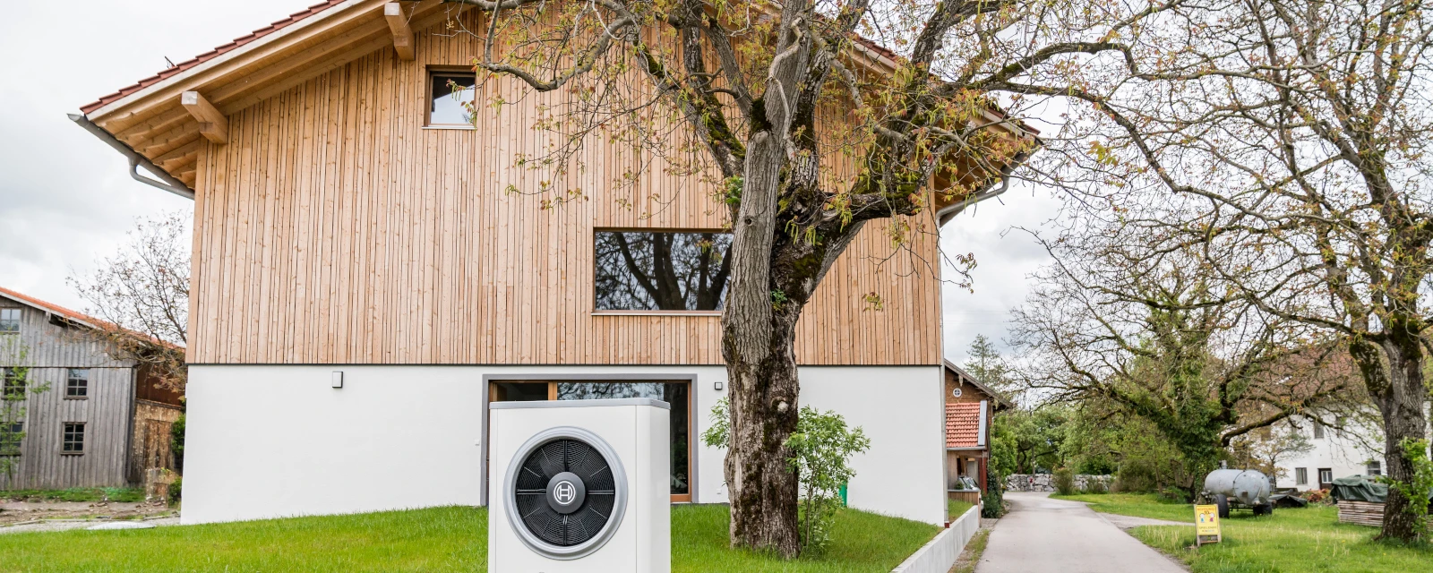 Heat pump in front of a house