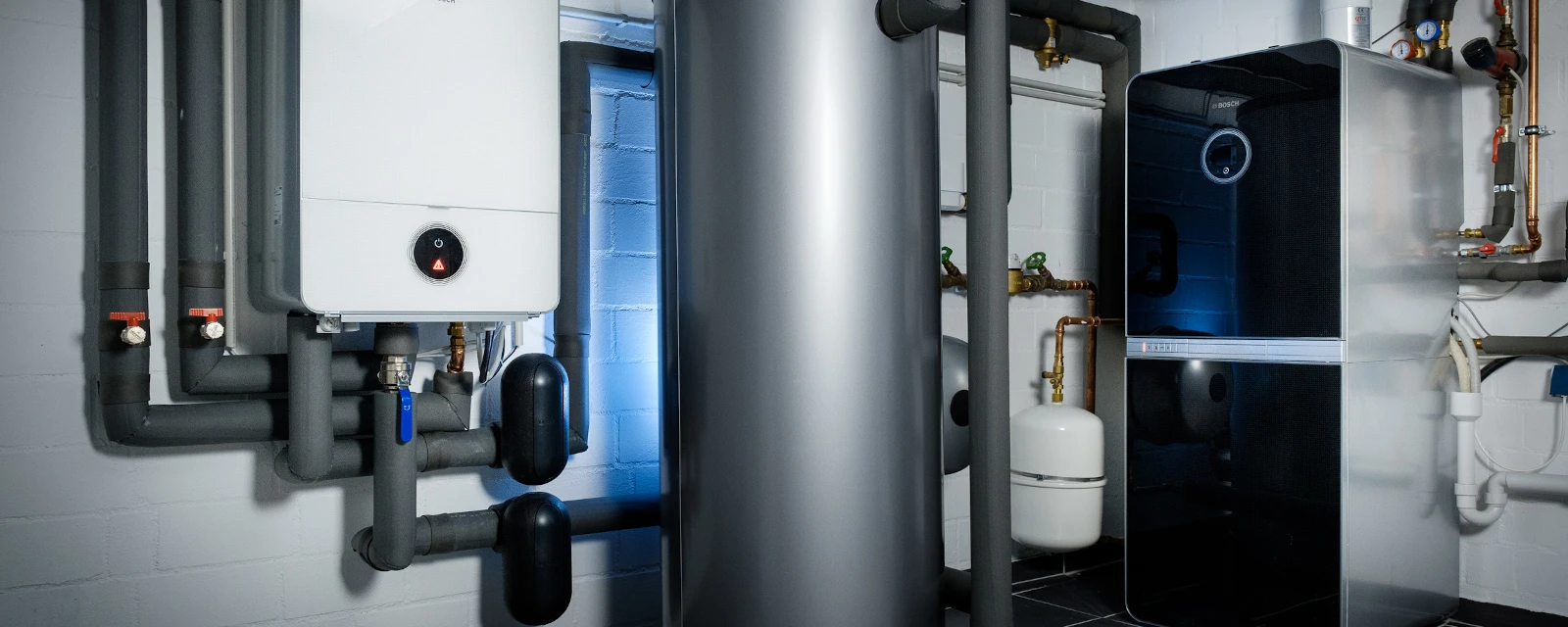 A buffer tank is located in the basement of a house.