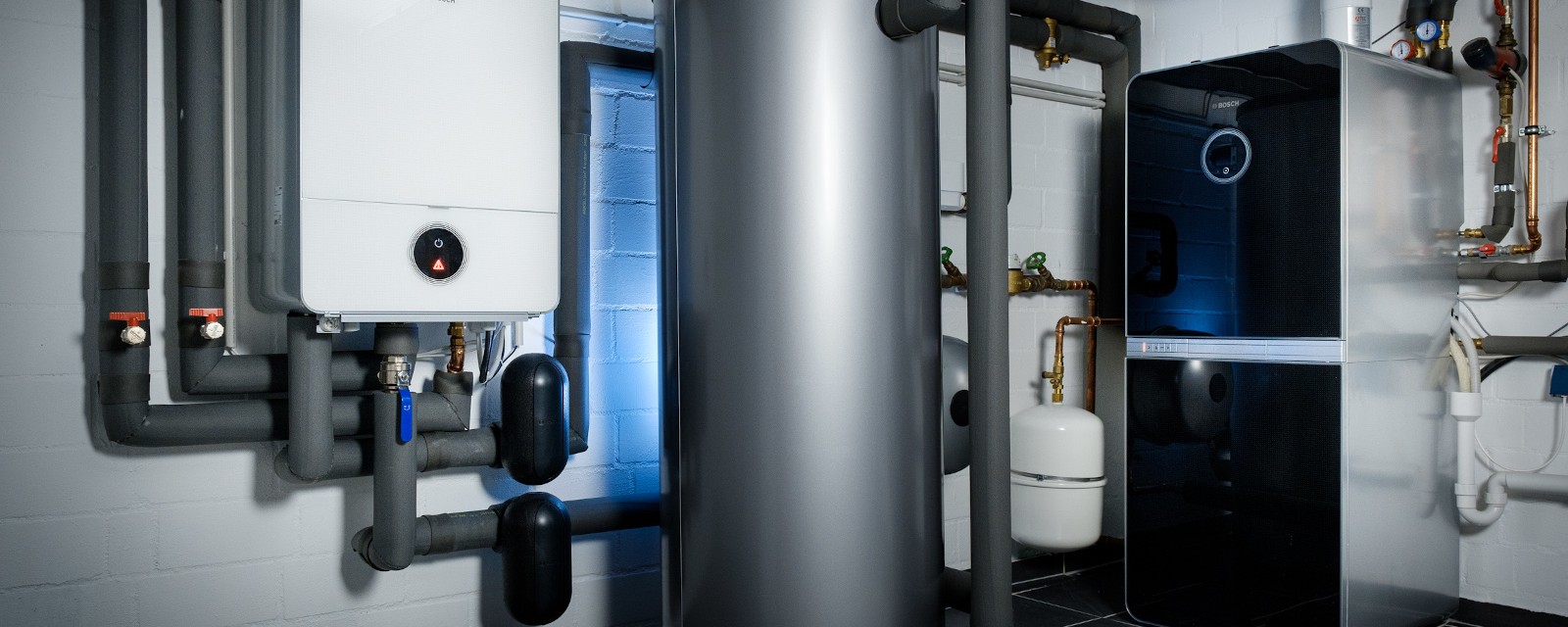 A buffer tank is located in the basement of a house. A buffer tank is located in the basement of a house.