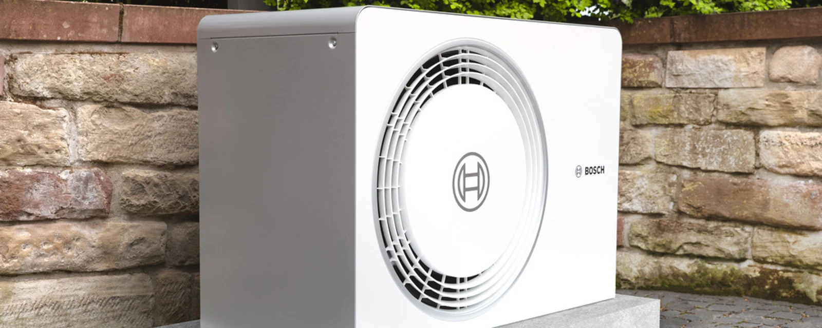 The heat pump is located in front of a Scandinavian house.