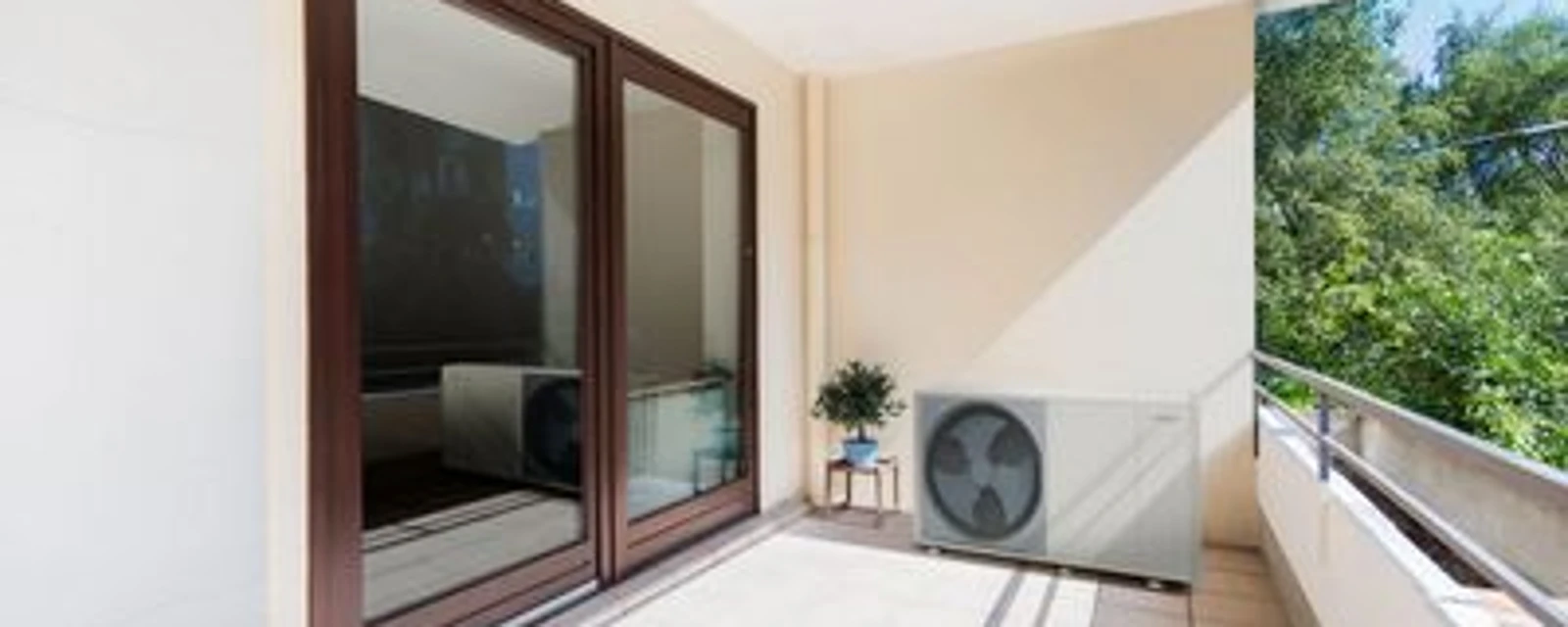 Bosch Compress 7400i AW heat pump standing on house wall