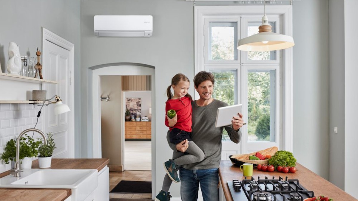 Man with child standing in the kitchen Man with child standing in the kitchen