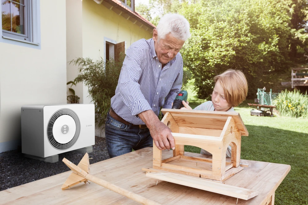 grandfather with child in garden