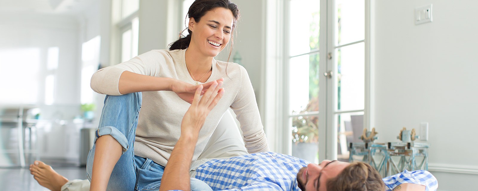 A young couple enjoys their togetherness in a modern living room. A young couple enjoys their togetherness in a modern living room.