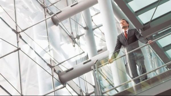businessman_in_a_house_looks_into_the_distance