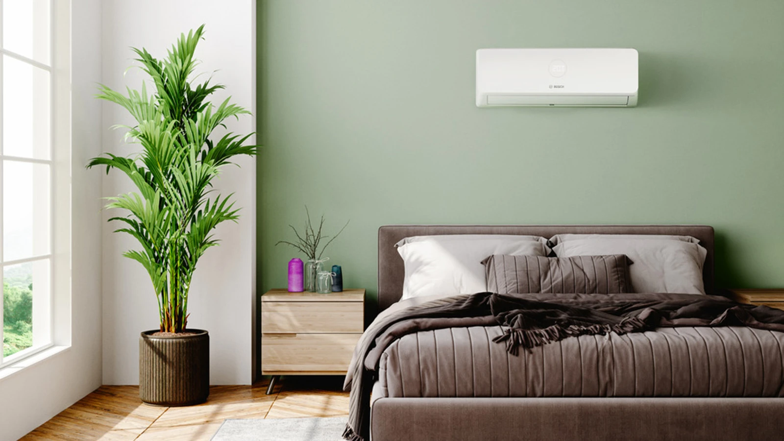 Ein Schlafzimmer, in dem eine Klimaanlage von Bosch an der Wand montiert ist.