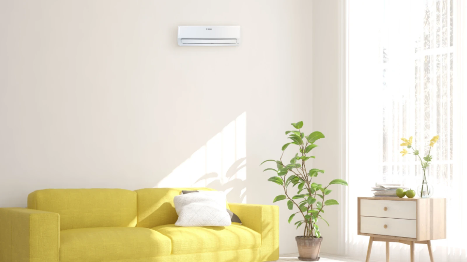 Eine an der Wand montierte Klimaanlage in einer Wohnung, in der Sonne hineinkommt.