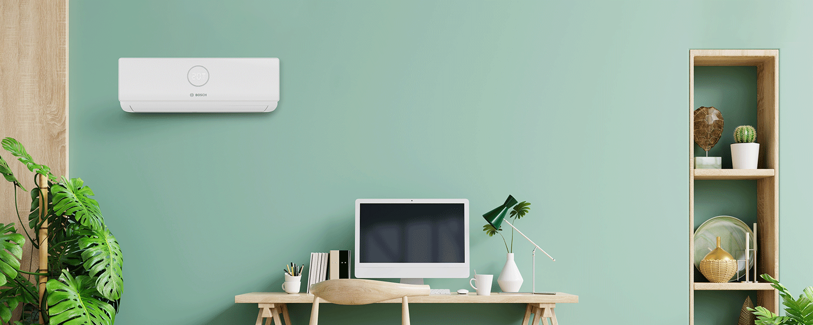 Klimagerät von Bosch hängt an der grünen Wand eine Arbeitszimmers.. Klimagerät von Bosch hängt an der grünen Wand eine Arbeitszimmers..