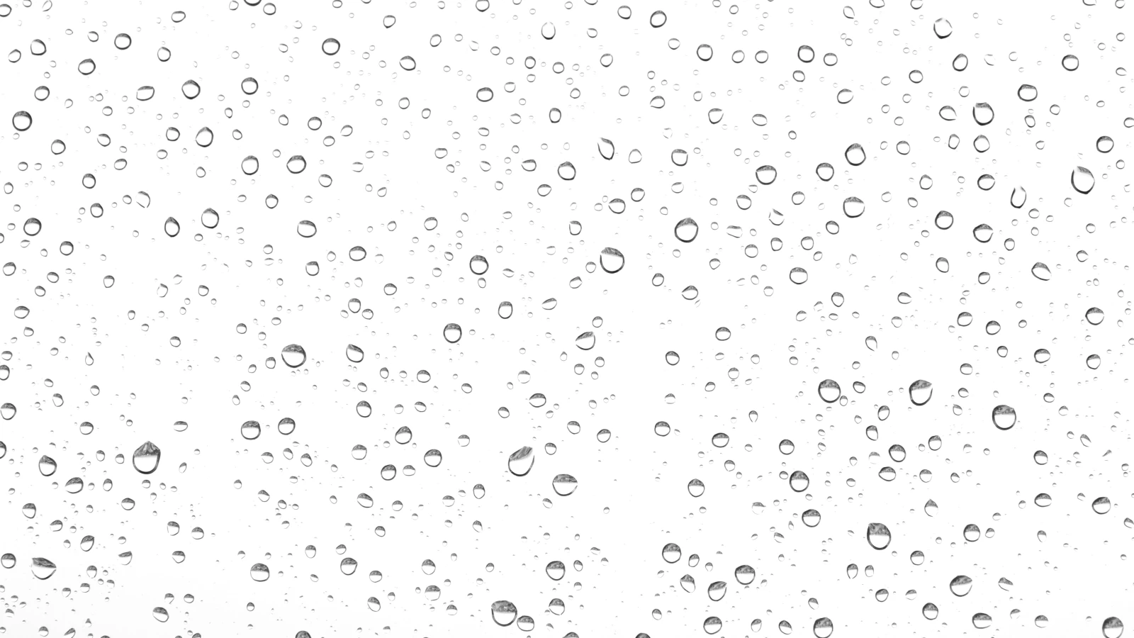 Wassertropfen an einer Oberfläche als Beispiel für das Prinzip der Adsorption, bei der sich Moleküle an einen Festkörper anlagern.