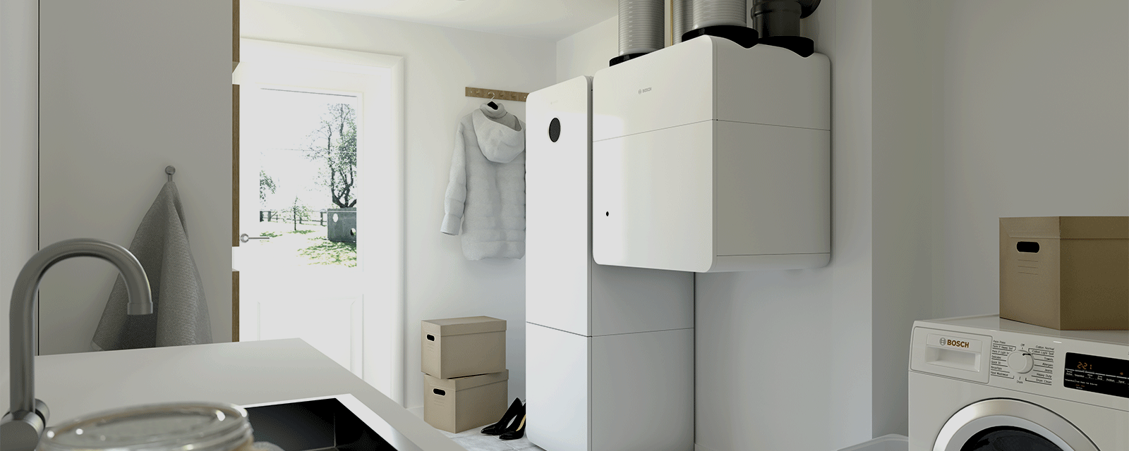 Ein Hauswirtschaftsraum in dem eine Bosch Erwärmepumpe steht. Ein Hauswirtschaftsraum in dem eine Bosch Erwärmepumpe steht.