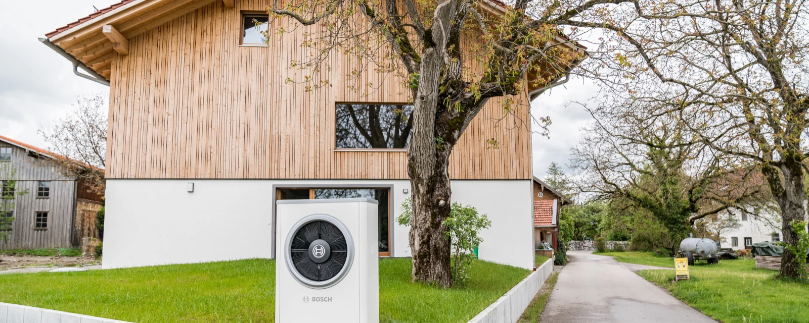 Heat pump in front of a house