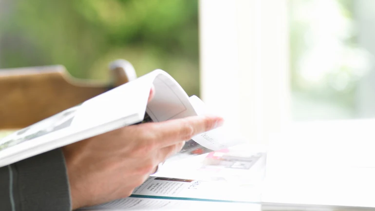 hand holds brochure