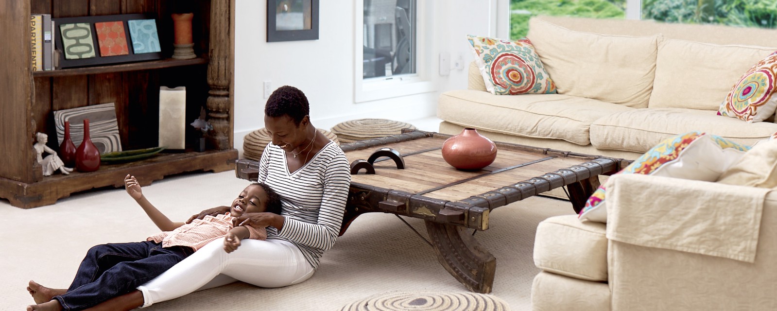 Mother and child in a living room.