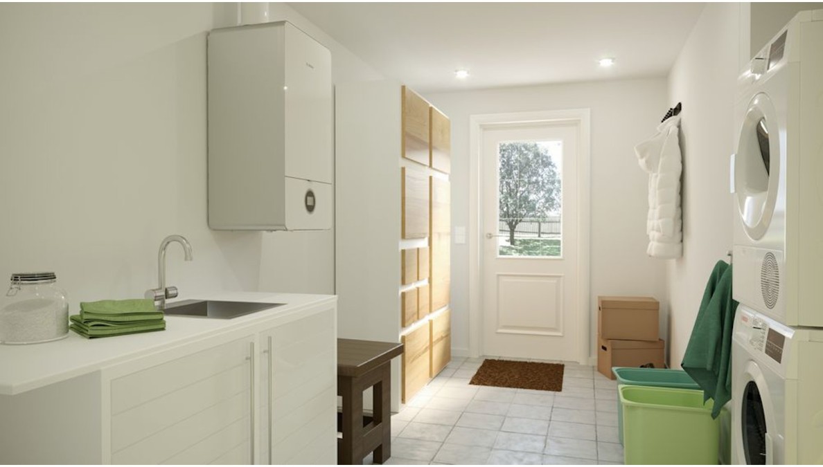 The Condens 7000i W gas condensing boiler hangs in the utility room. The Condens 7000i W gas condensing boiler hangs in the utility room.