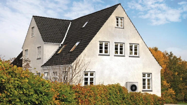 Old building of a family house equipped with a Bosch heat pump