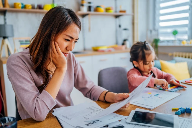 Woman looking at utility bill