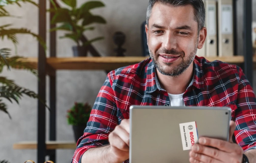 Contractor using lead management tool on tablet